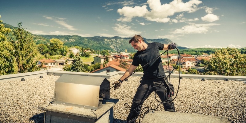 man sweeping chimney